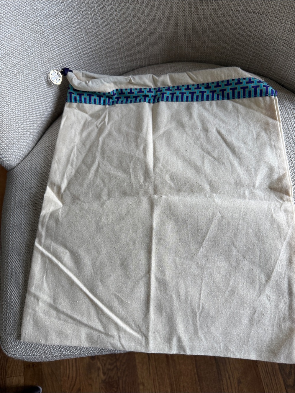 Tory Burch Cream Dust Bag with Blue and Teal Trim and Gold Medallion